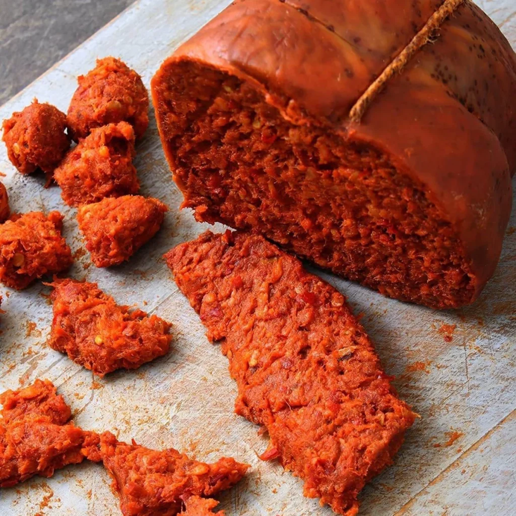 Storia della ’nduja calabrese: origine, tradizione e gusto autentico